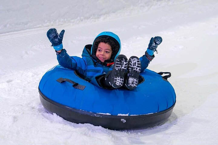 Experience the joy of snow tubing in a winter wonderland where laughter fills the air and snowy adventures await all ages in Abu Dhabi's unique indoor park.